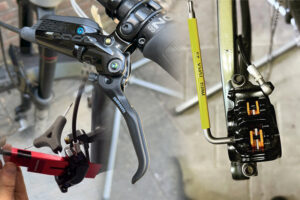 Close-up van MTB-schijfrem onderhoud met remhendel, remklauw en gereedschap tijdens de mtb onderhoud workshop